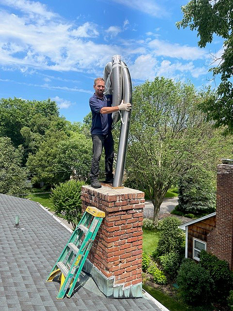 Roger works on a chimney after his mitral valve repair surgery