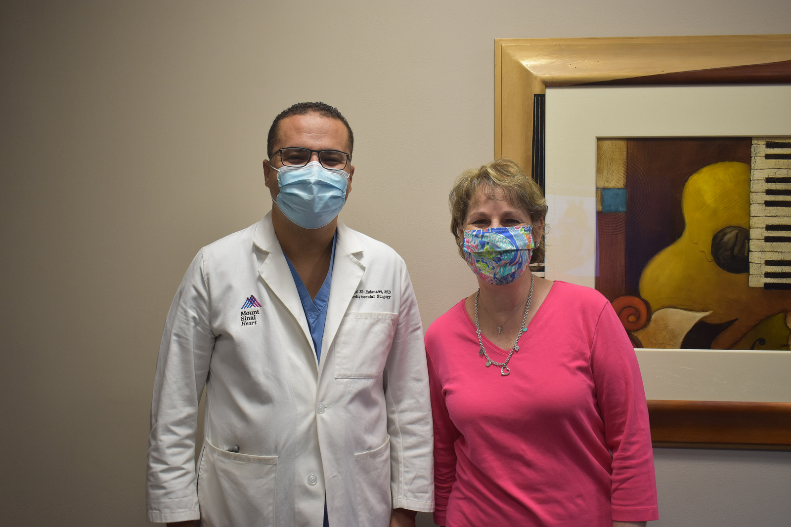 Dr. El-Eshmawi and Laurie during a follow-up visit 11 months after her surgery.