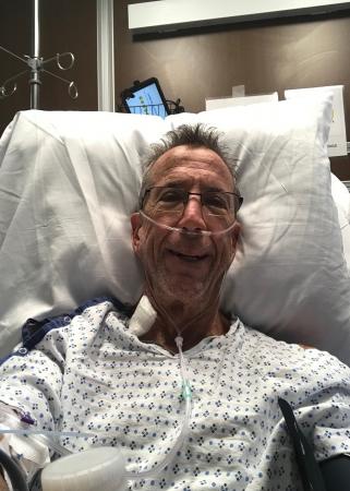 Larry recovers in the ICU after mitral valve repair surgery. 