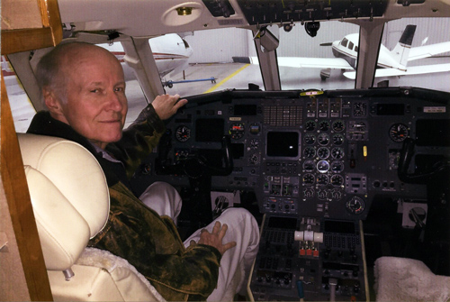 Allan E. in the cockpit after the FAA approved his return to flying, post surgery.