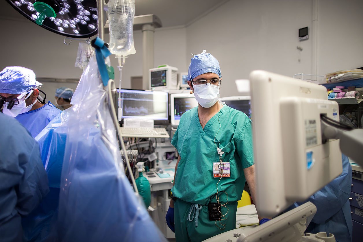 Menachem Weiner, MD monitors a patient's vitals during surgery