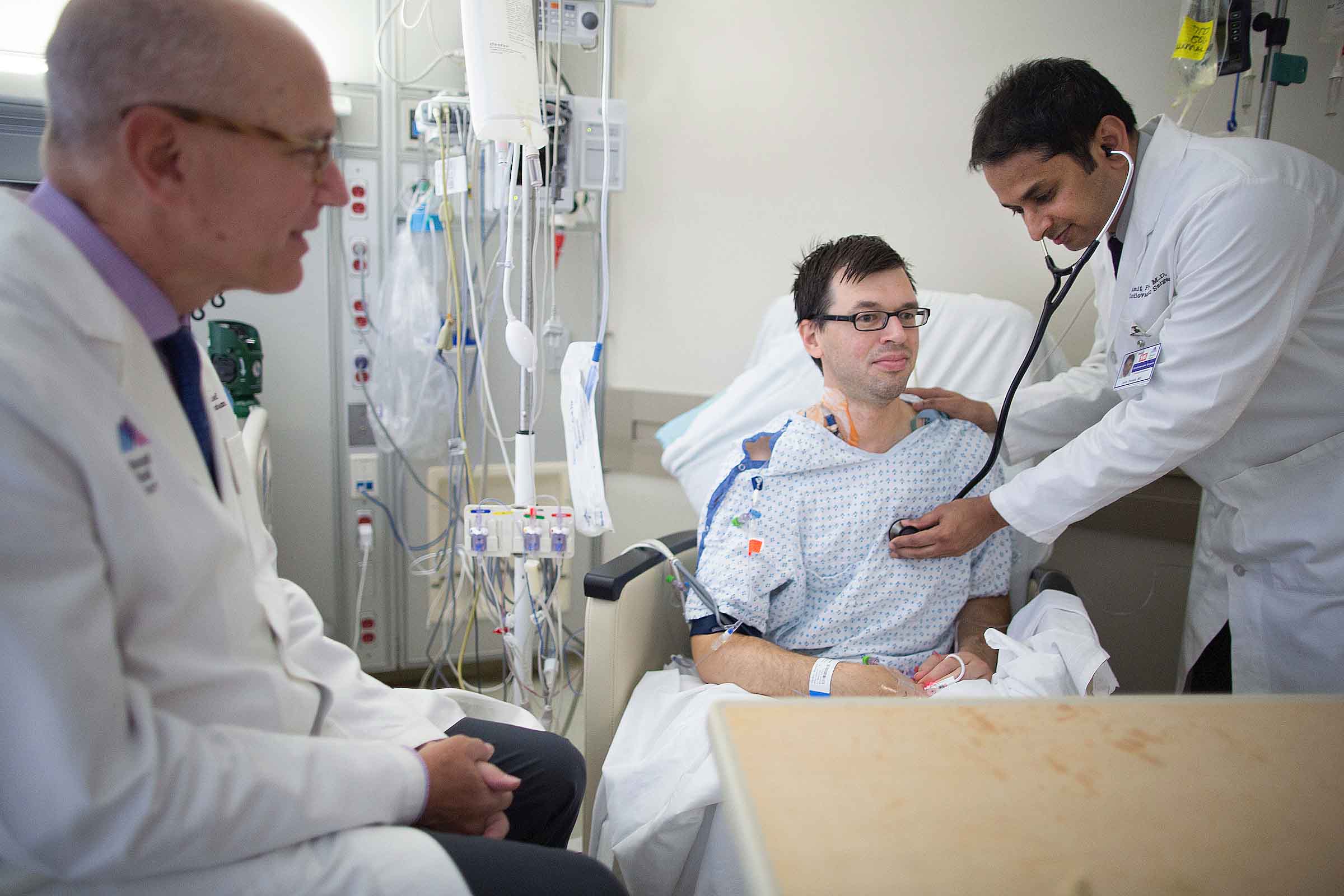 Dr. Pawale examines patient