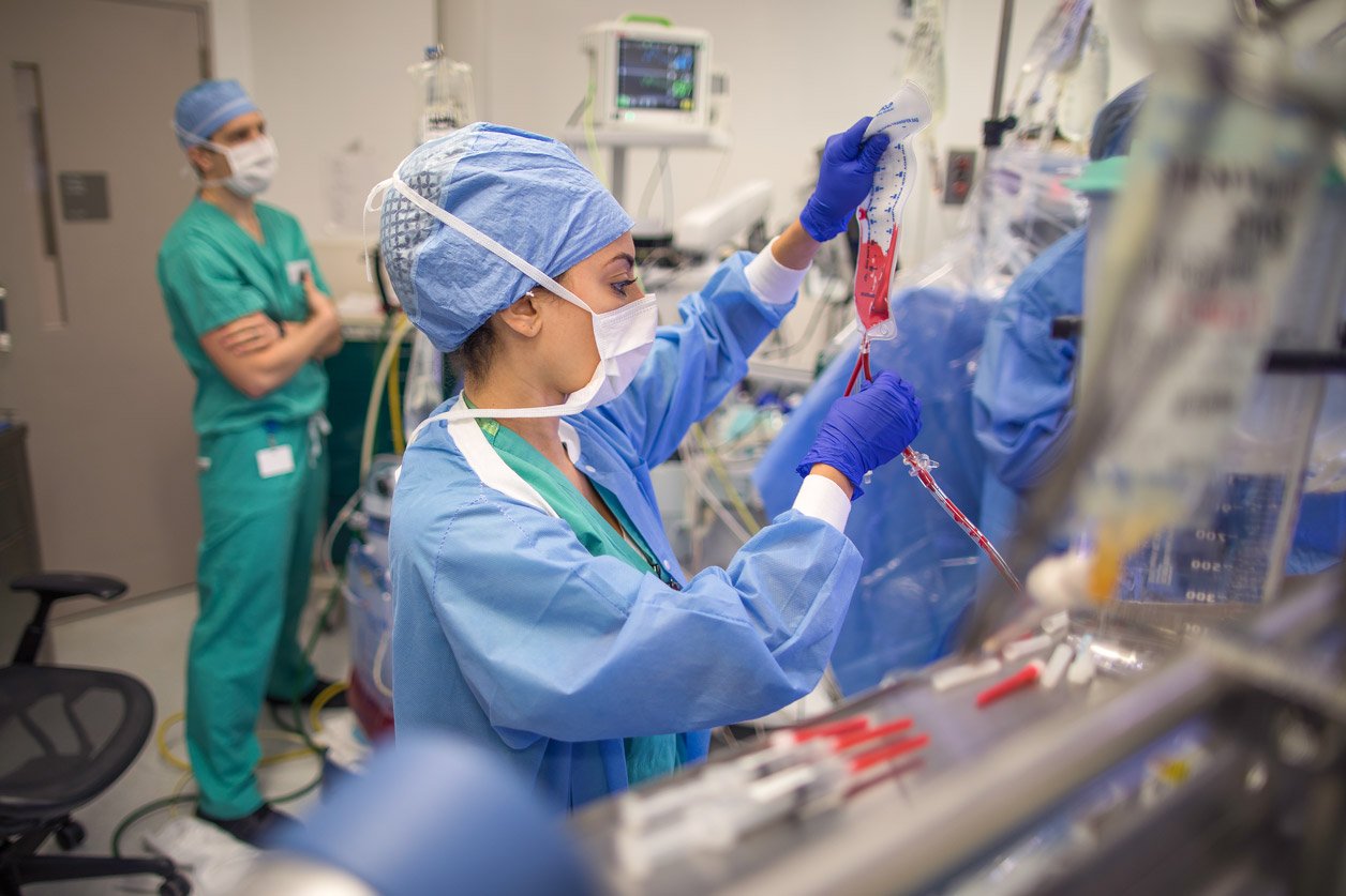 A Mount Sinai perfusionist operates the heart lung machine during a mitral valve repair surgery.