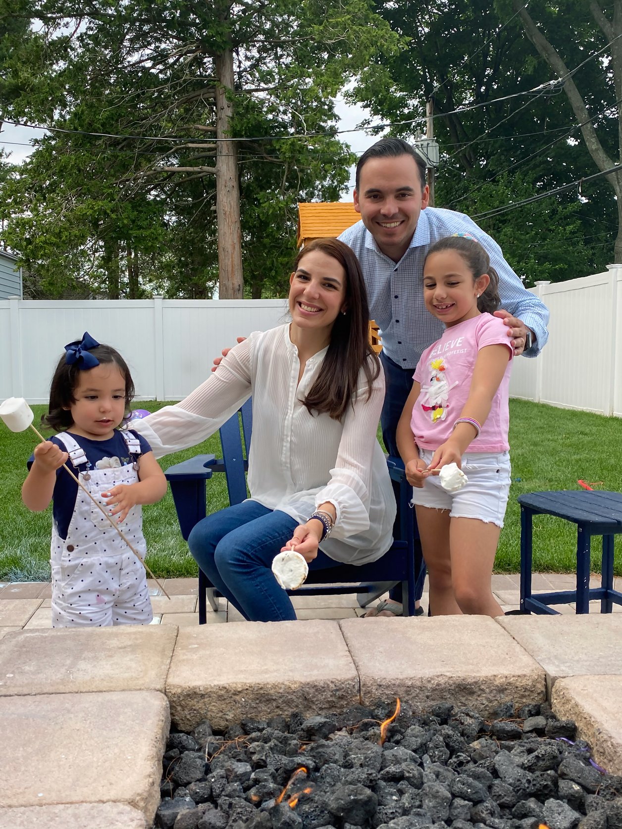 Carmen and her family roast marshmallows at home, weeks after her surgery.