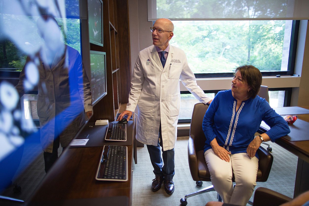 Dr. Adams speaks with a patient during a surgical consultation.