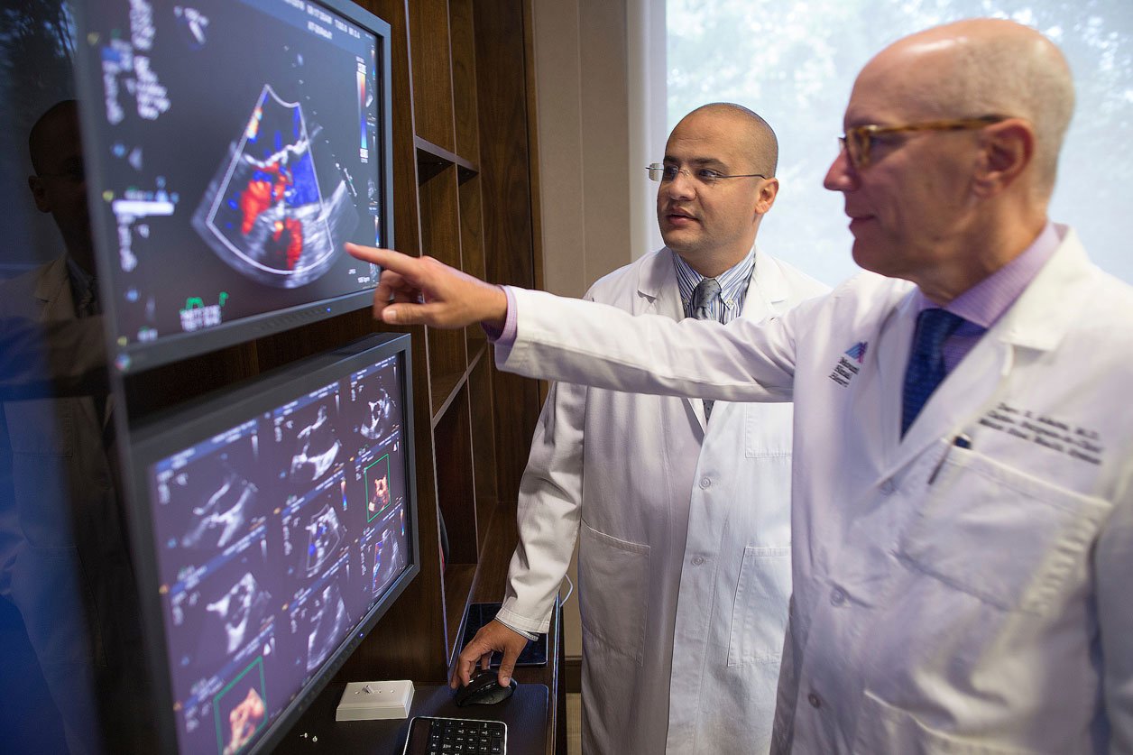 Drs. Adams and El-Eshmawi review a patient's echocardiogram during a surgical consultation visit.
